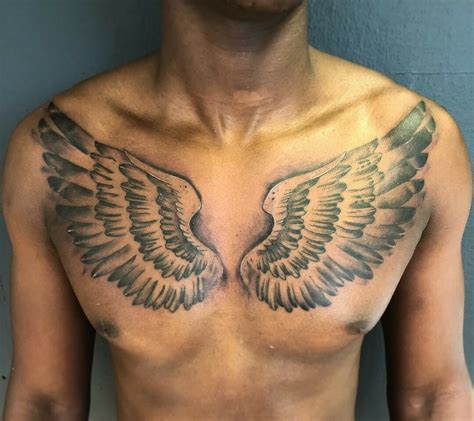 tattoo hermes wings|chest wing tattoos for men.